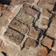 4,400-year-old bricks. Lothal was built around its port using the same plans and building materials as other Indus cities. The houses were constructed on sun-dried brick platforms, separated by streets laid out in a grid.