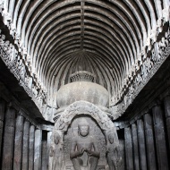 A roof made to look like wooden beams and a 15-foot high effigy of Buddha in the preaching pose characterize Cave 10.